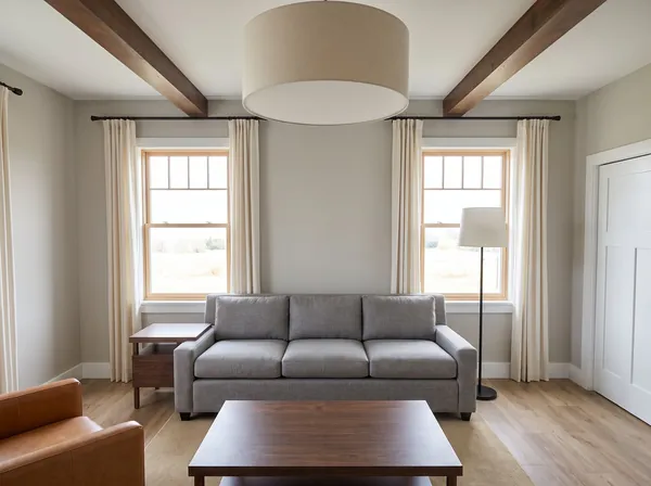 Living room with wood double-hung windows and large drum pendant